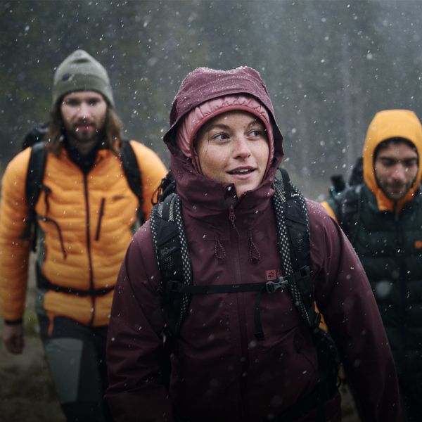 Woman wearing a waterproof jacket in the rain