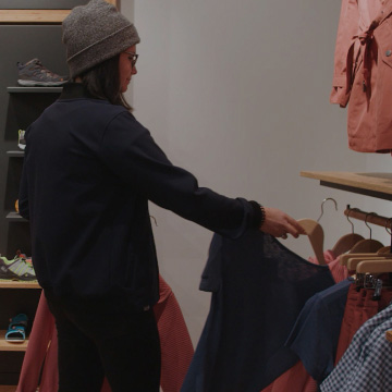 Shop assistant, with shoes in the background